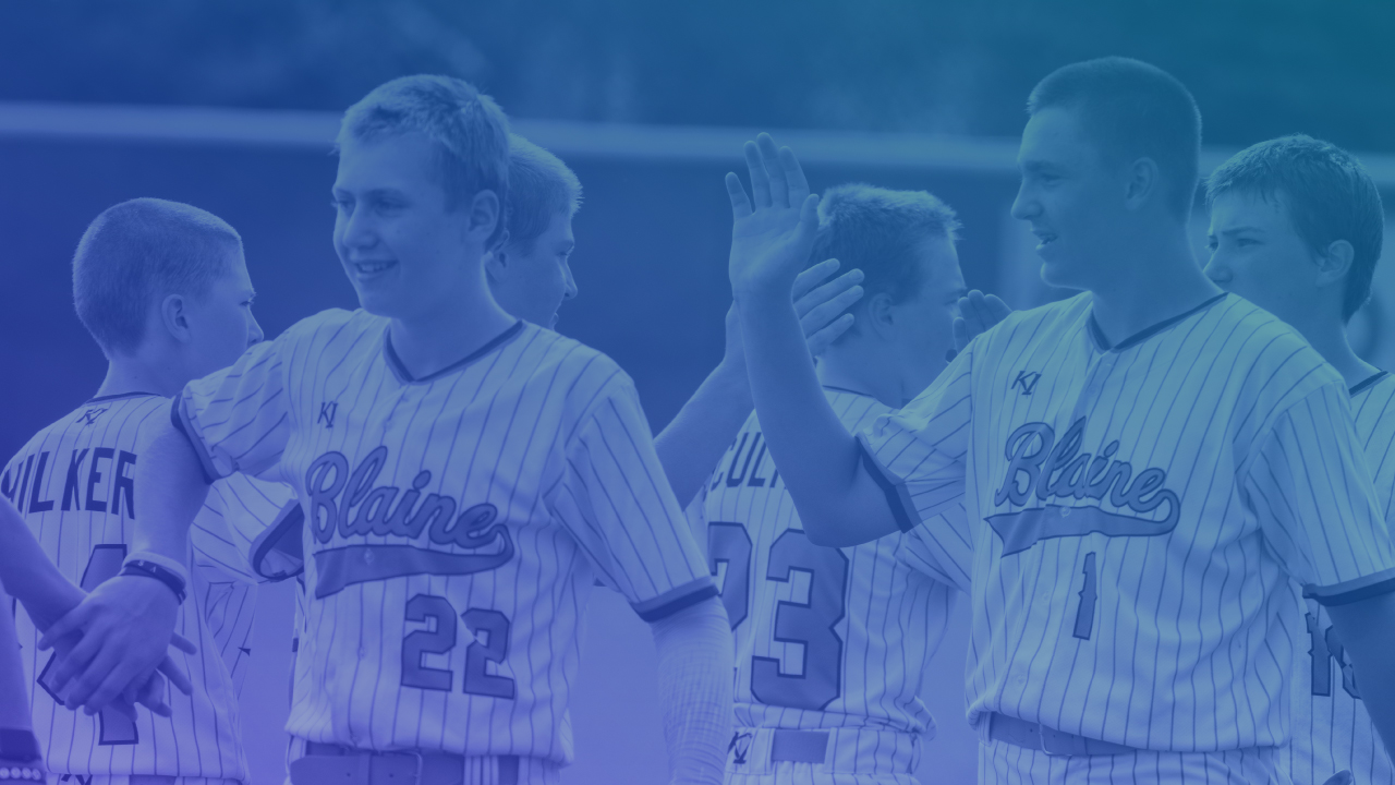 youth baseball players shaking hands after a game